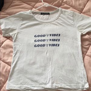 a brandy melville “good vibes” t shirt